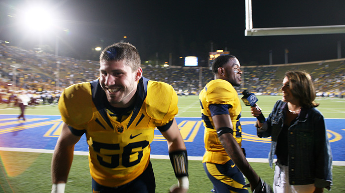 Zach Follett plays a joke during Darian Hagan's post-game interview