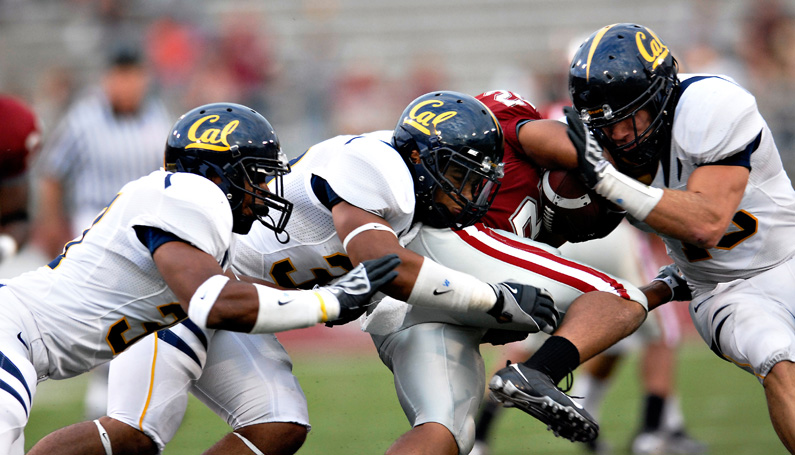 Nikon D200, 400mm: Cal defenders team up to bring down a Washington State player