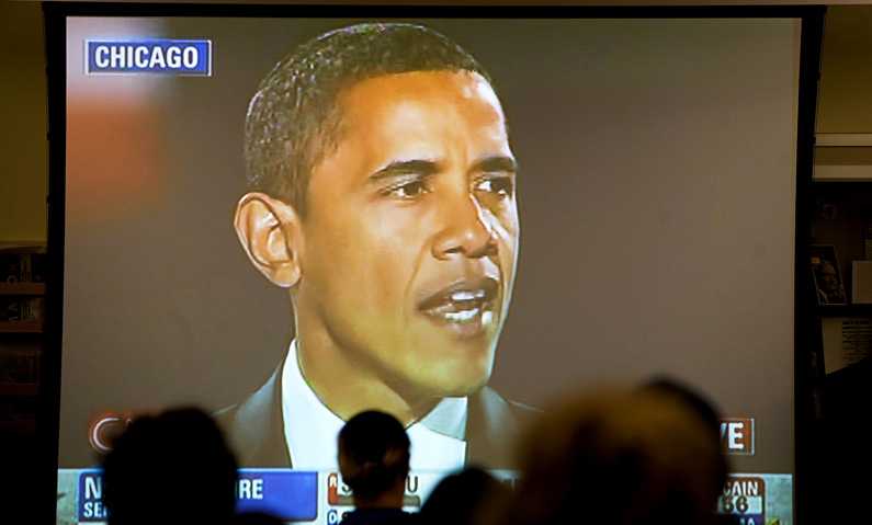 Members of the public watch a broadcast of Senator Barack Obama's victory speech at the IGS Library in Moses Hall